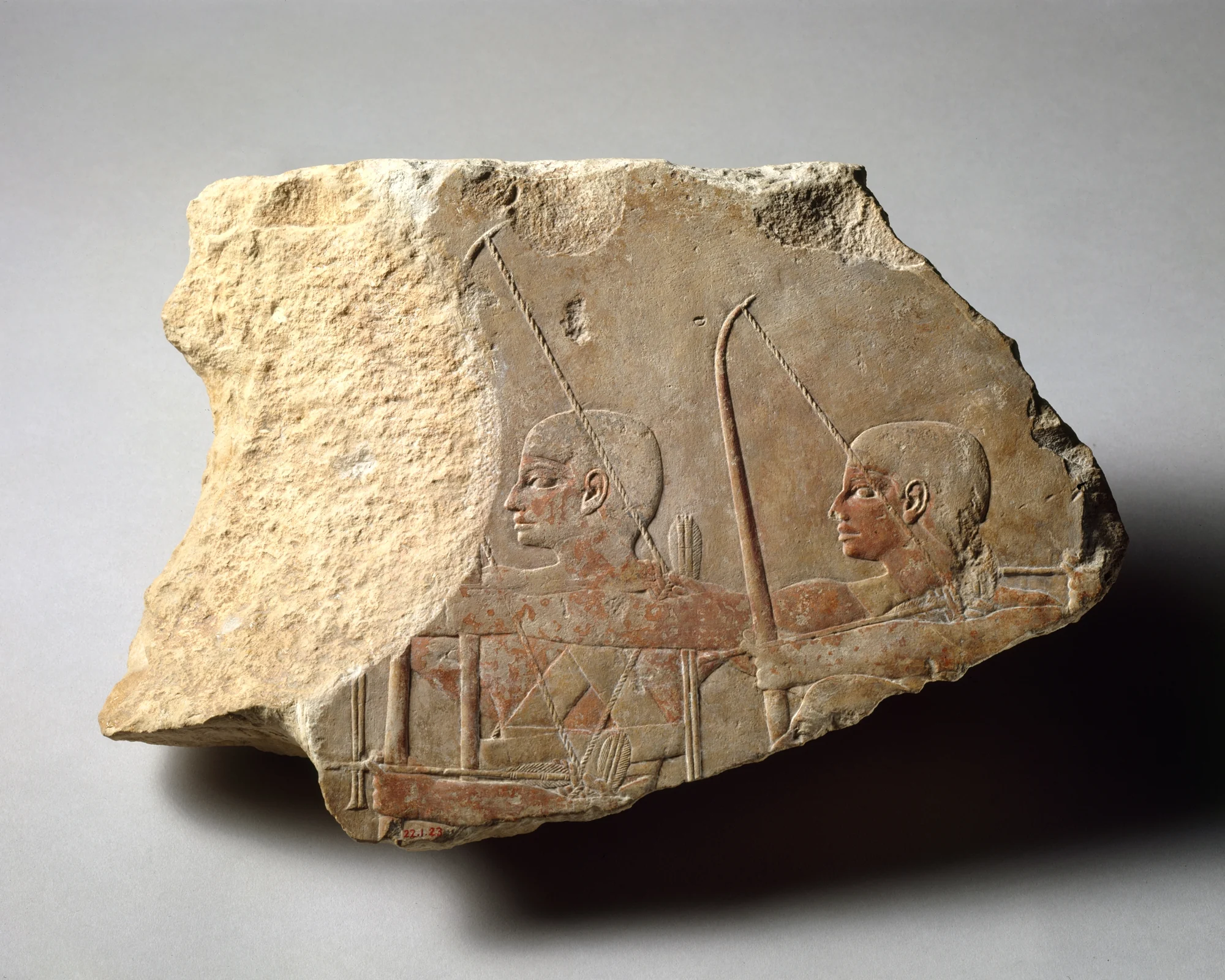 Fourth Dynasty limestone relief depicting archers, dated to the reign of Khufu or Khafre, Met 22.1.23